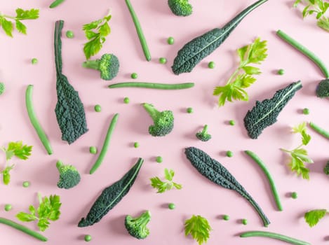top view of fresh green vegetables on the pink table