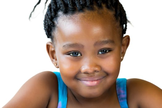 Close up face shot of cute smiling african girl with braided hair isolated against white background..