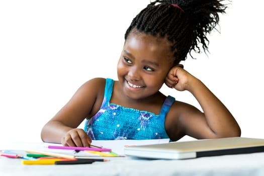 Close up portrait of little african girl at desk with color pencils and laptop.Isolated on white background.