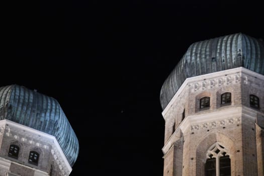 The Welschen Hauben of the Frauenkirche in Munich in the evening. Munich Bavaria Archbishop Freising Landmark Church Tower Towers Gothic sight Catholic onion domes Cathedral of Our Lady Top 10 Women's Square