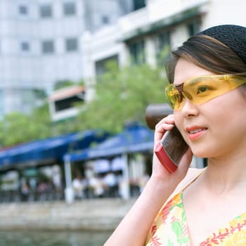 Close-up of a young woman talking on a mobile phone