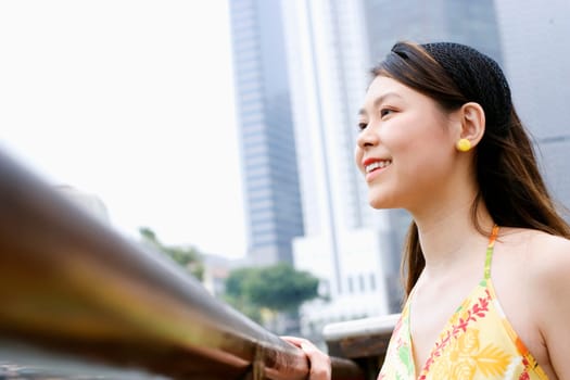 Side profile of a young woman smiling