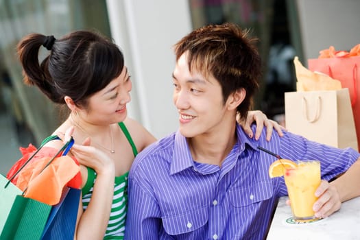 Close-up of a young couple looking at each other and smiling