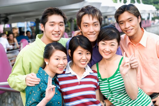 Portrait of a group of people standing together and smiling