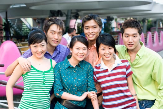 Portrait of a group of people standing together and smiling