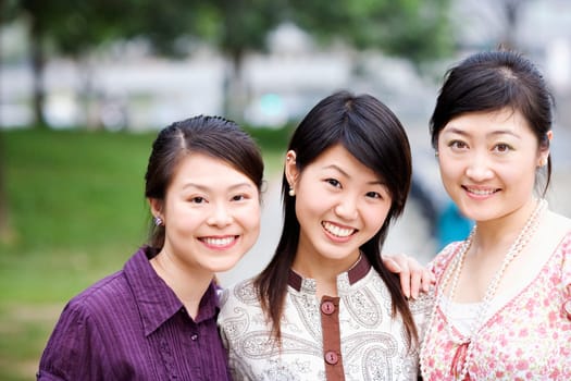 Close-up of three young women smiling