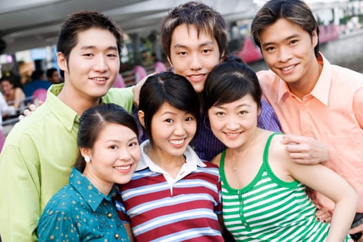 Portrait of a group of people standing together and smiling