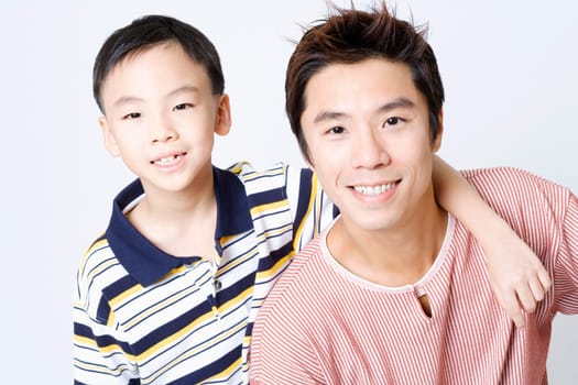 Portrait of a mid adult man smiling with his son