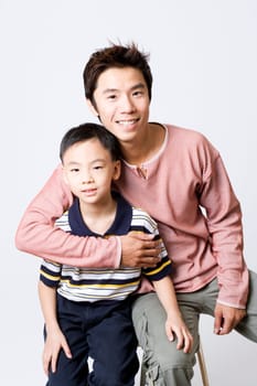 Portrait of a mid adult man smiling with his son