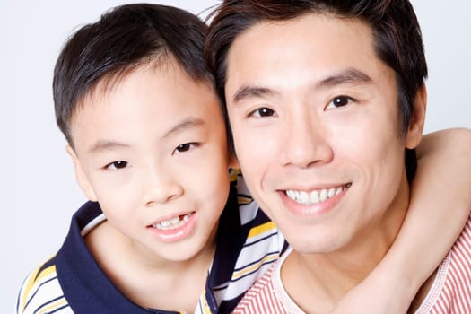 Portrait of a mid adult man smiling with his son