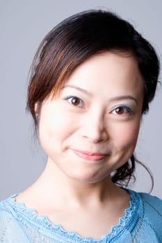 Portrait of a young woman grinning