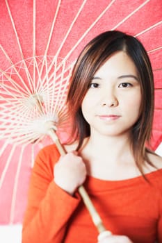 Portrait of a mid adult woman holding a parasol