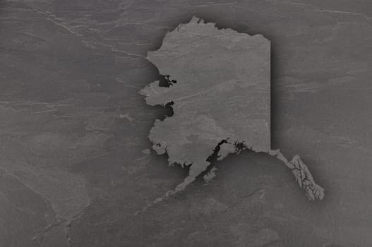 Map of Alaska on dark slate