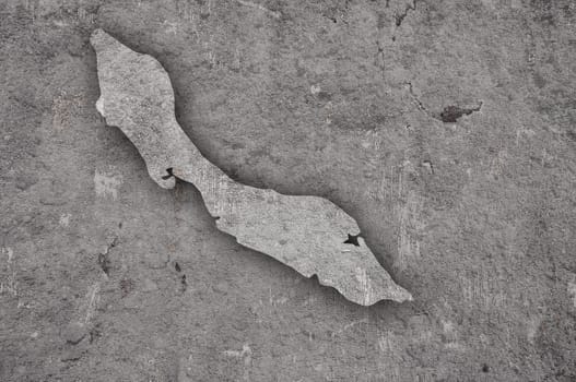 Map of Curacao on weathered concrete