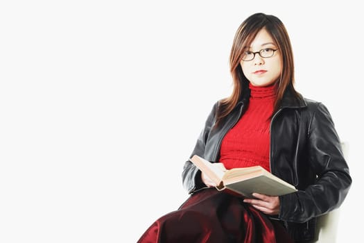 Portrait of a mid adult woman holding an open book