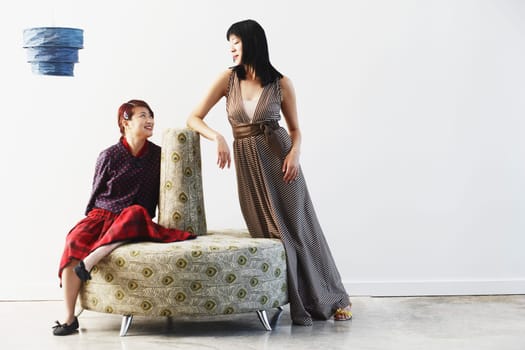 Two young women looking at each other