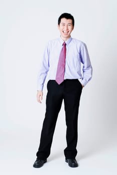 Portrait of a businessman standing with his hands in his pockets