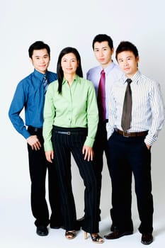 Portrait of three businessmen and a businesswoman standing