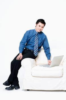 Portrait of a businessman using a laptop
