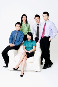 Portrait of two businesswomen and three businessmen smiling