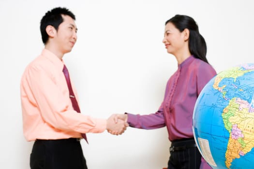 Businesswoman shaking hands with a businessman