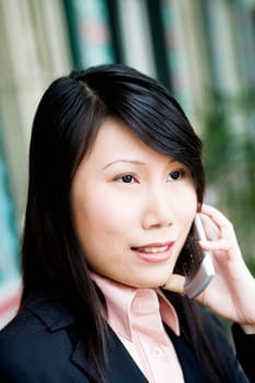 Close-up of a businesswoman talking on a mobile phone