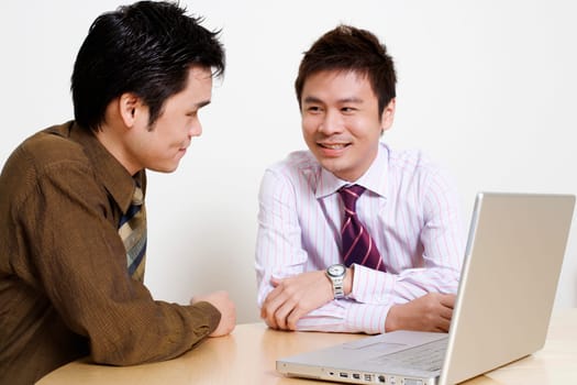 Two businessmen discussing