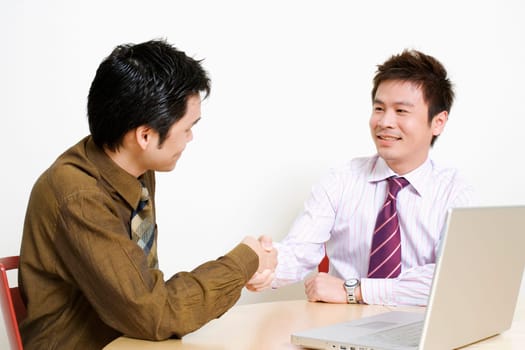 Two businessmen shaking hands