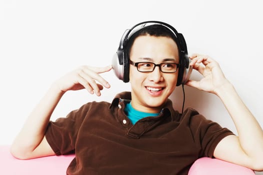 Close-up of a young man wearing headphones