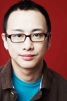 Portrait of a young man grinning
