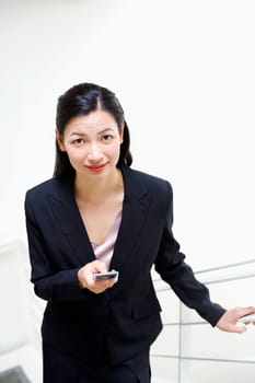 Portrait of a businesswoman operating a mobile phone
