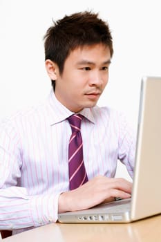 Close-up of a businessman using a laptop