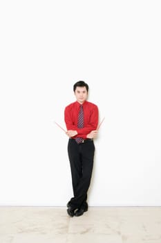 Portrait of a businessman holding chopsticks