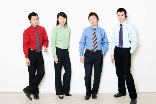 Portrait of four customer service representative standing together