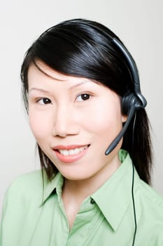 Portrait of a female customer service representative using a headset