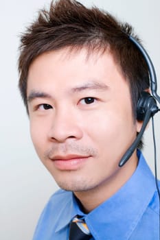 Portrait of a male customer service representative using a headset