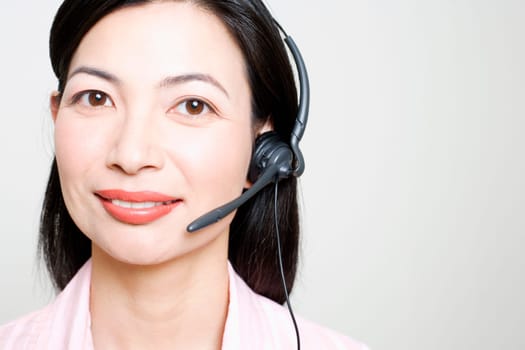 Portrait of a female customer service representative using a headset