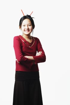 Portrait of a teenage girl smiling with her arms crossed