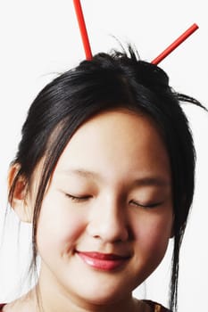 Close-up of a teenage girl with her eyes closed