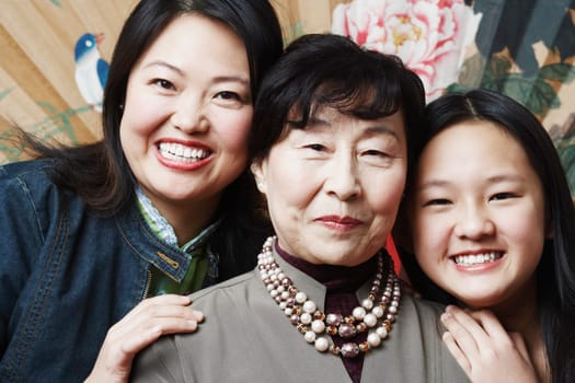 Portrait of a grandmother with her daughter and granddaughter