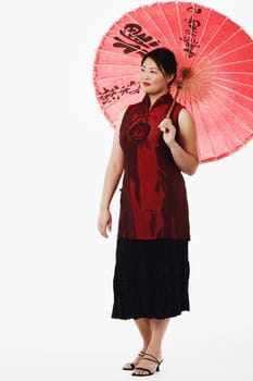 Mid adult woman holding a parasol