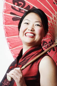 Portrait of a mid adult woman holding a parasol