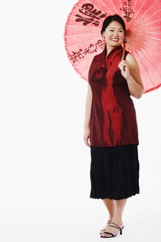Mid adult woman holding a parasol