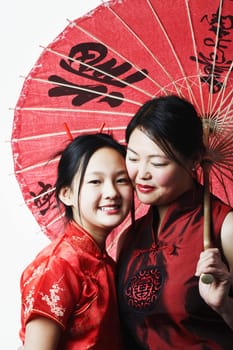 Close-up of a mother and her daughter smiling