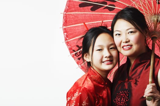 Portrait of a mother and her daughter smiling
