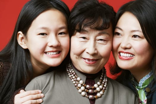 Portrait of a grandmother and her granddaughter smiling