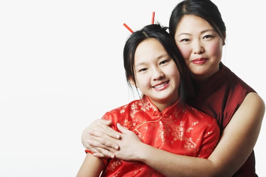 Portrait of a mother hugging her daughter