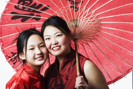 Portrait of a mother and her daughter smiling