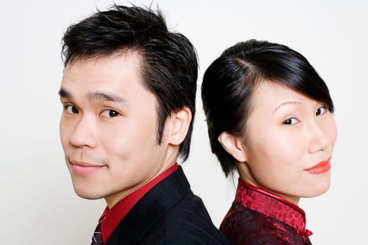 Portrait of a mid adult man and a young woman smiling