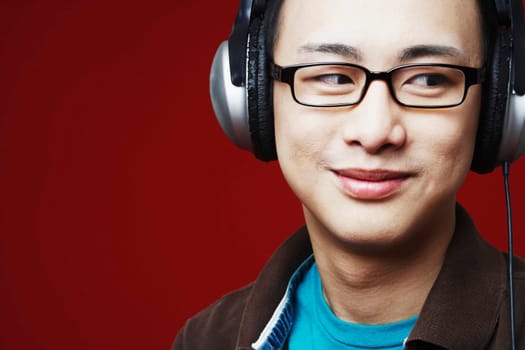 Close-up of a young man wearing headphones